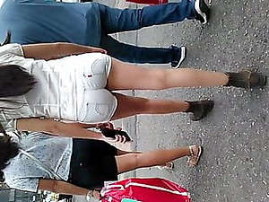 Ass walking with short jeans in the parking lot